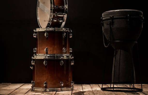 istock musical percussion instruments on black background drum Bongo and snare 656100926
