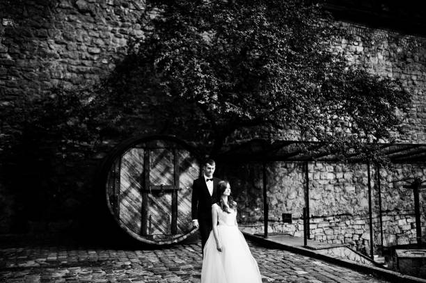 istock Married couple stay near old big barrel 656103426