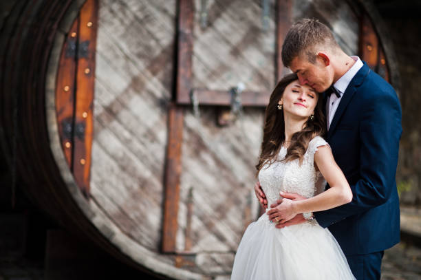 istock Married couple stay near old big barrel 656103488