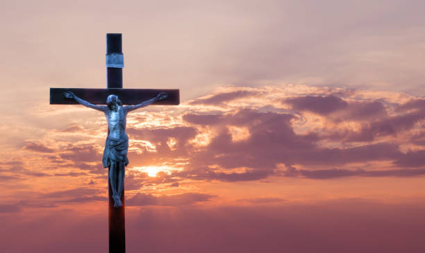 istock Jesus Christ on the cross over sunrise background 656103990