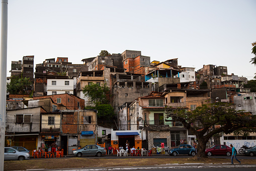 Local people meeting in small bars at the entrance of a favela in the centre of Salvador