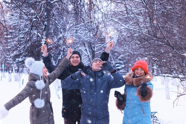 istock group of young people with sparklers on holidays 656104424