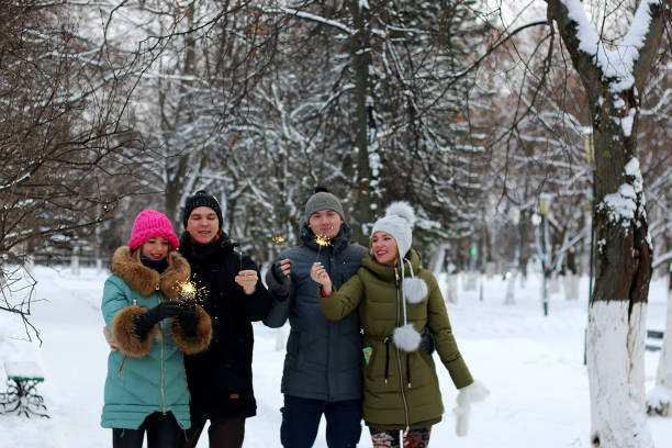 istock group of young people with sparklers 656104634