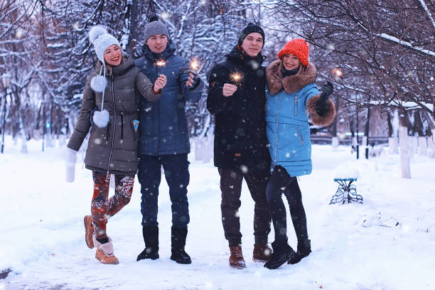 istock group of young people with sparklers on holidays 656104688