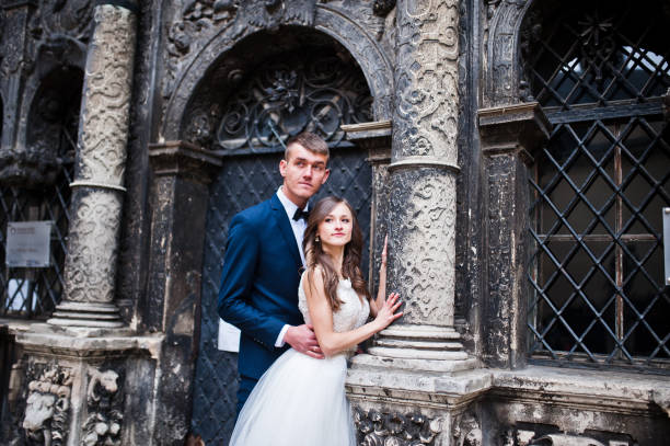 istock Wedding couple near old architecture 656105498