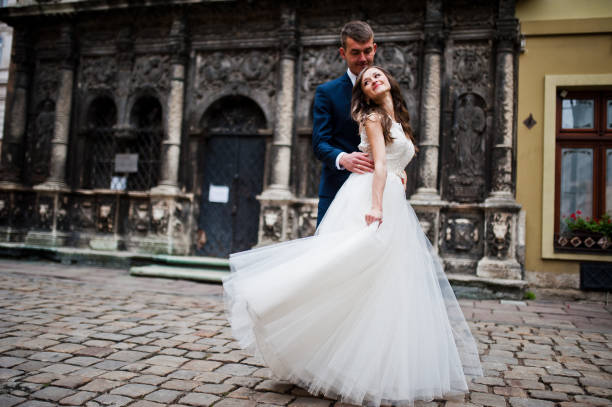 istock Wedding couple near old architecture 656105572
