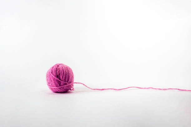 Ball of yarn on white background Pink Ball of yarn on white background clew bay stock pictures, royalty-free photos & images