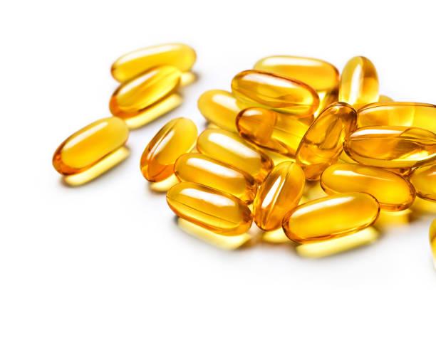 istock Heap of capsules Omega 3 isolated on white background. 656111020