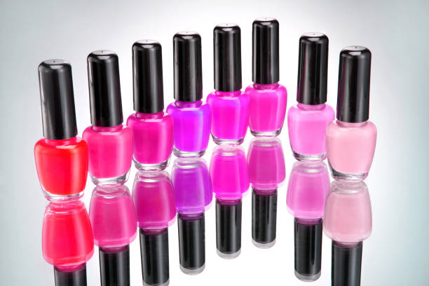istock Bottles of bright nail polish on grey background 656111602