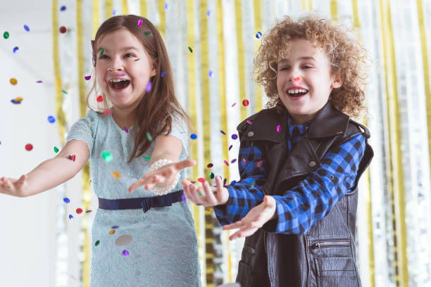 istock Little couple throwing confetti 656114824