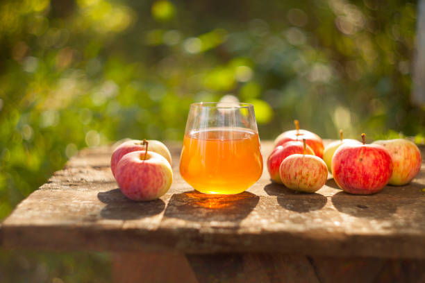 Delicious fresh squeezed apple juice in a transparent glass