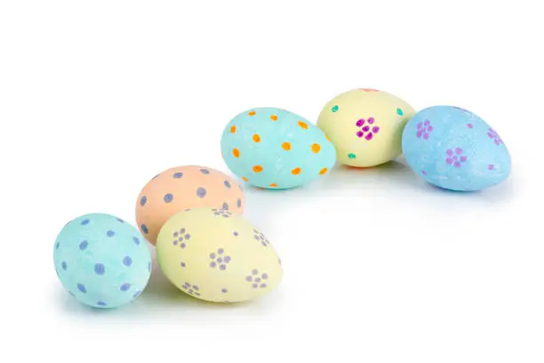 Colorful hand-painted easter eggs on white background