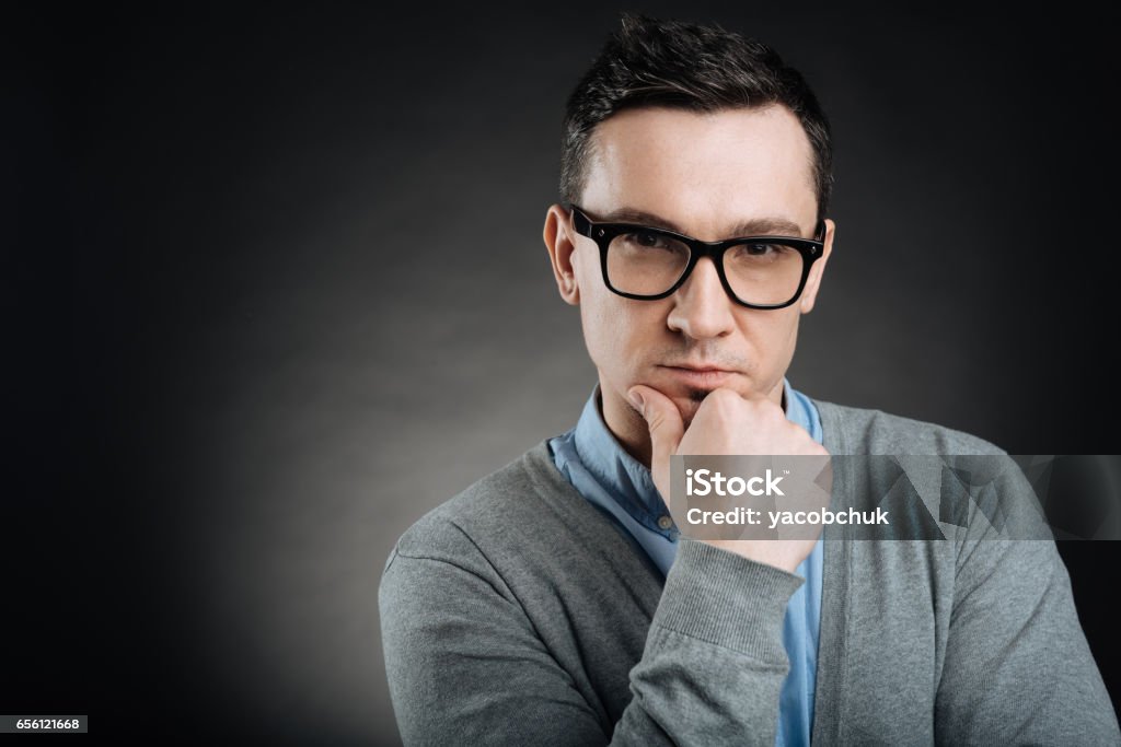 Serious Young Man Wearing Glasses Stock Photo - Download Image - Adult, Adults Only, Black Color - iStock