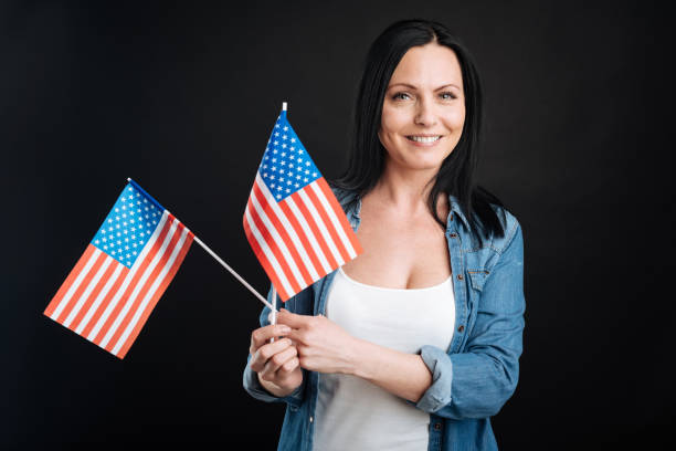 istock Positive delighted female keeping flags 656123266