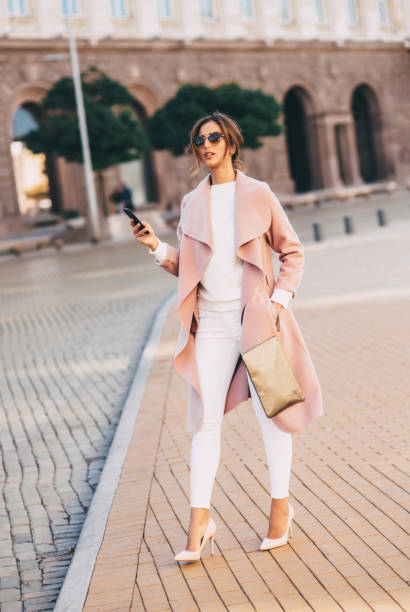 istock Beautiful elegant woman texting outdoors 656128524