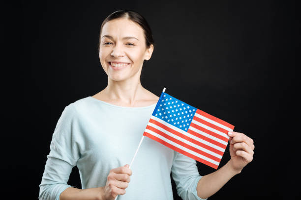 istock Proud young woman presenting favorite flag 656128712