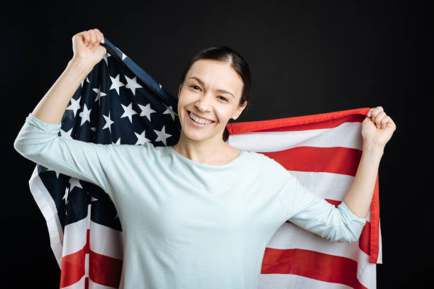 istock Positive female holding big flag on the background 656128756