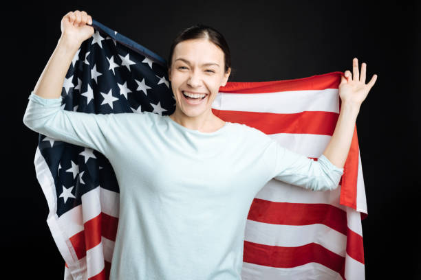 istock Joyful brunette girl posing with big flag 656128808