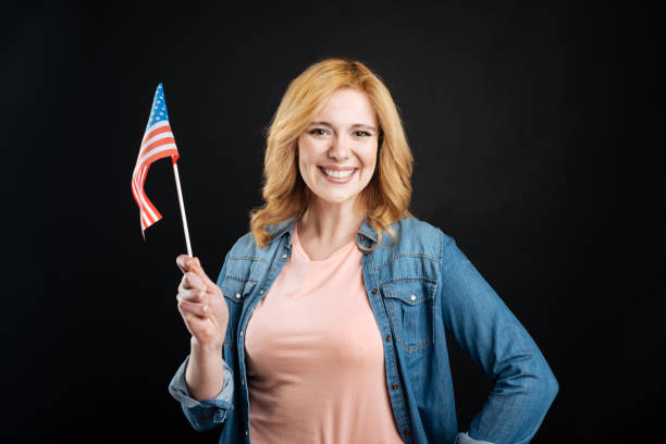 istock Happy woman while waving with flag 656129072