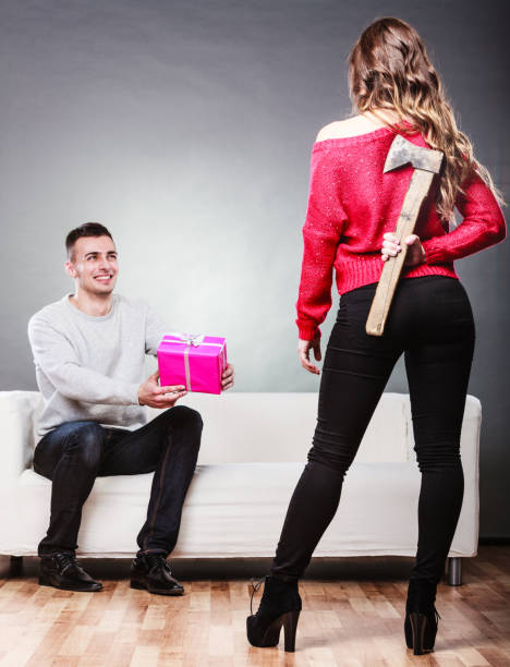 istock Trusting guy giving present to misleading girl 656129270