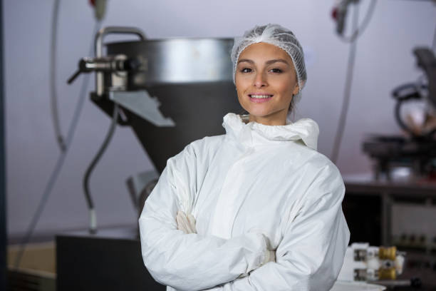 istock Female butcher standing with arms crossed 656130024