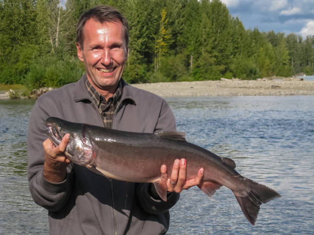 istock Angler fishing for salmon 656130034