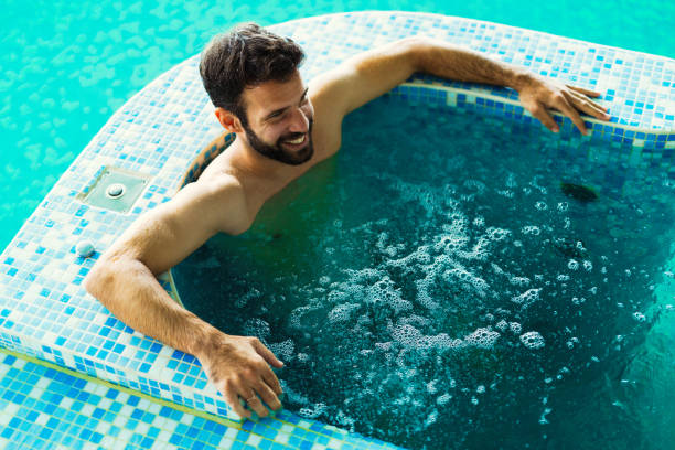 istock Handsome man enjoying bubble bath at spa resort 656130110