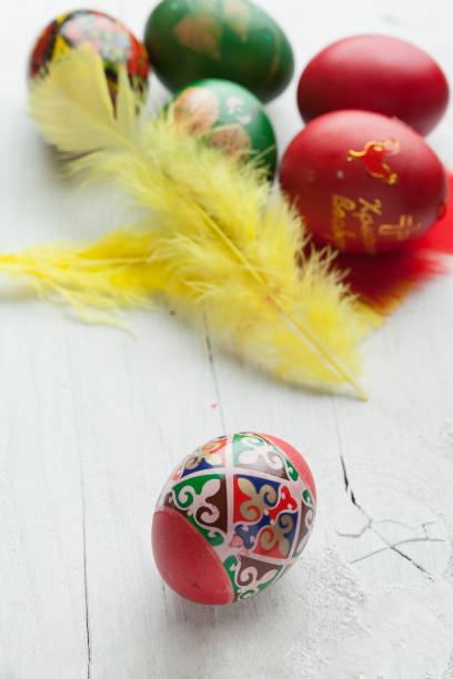 istock Easter eggs and white wooden country table, background and texture, copyspace 656130174