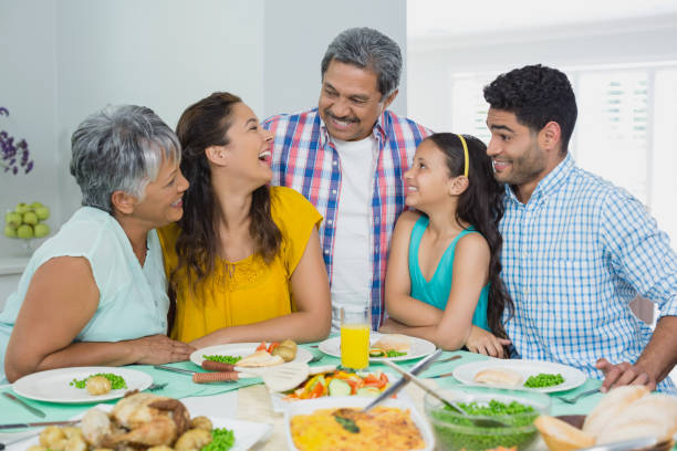 istock Happy multi generation family having meal on table at home 656132368