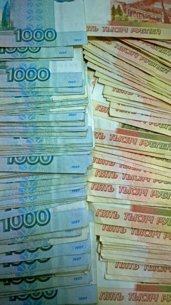 istock Russian banknotes of one thousand and five thousand rubles in two columns. Vertical view 656136498