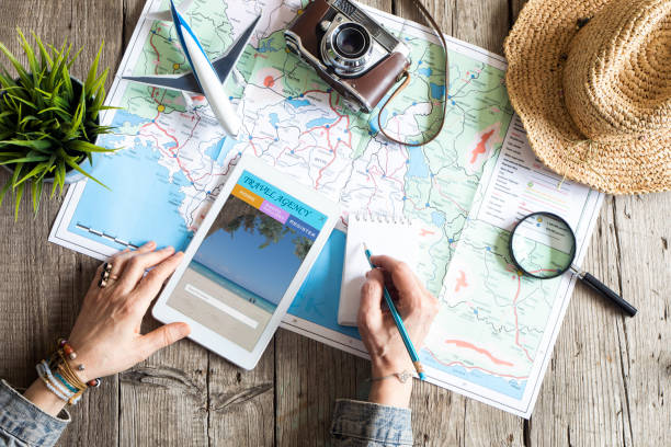 travel planning concept on map - map cartography travel human hand imagens e fotografias de stock