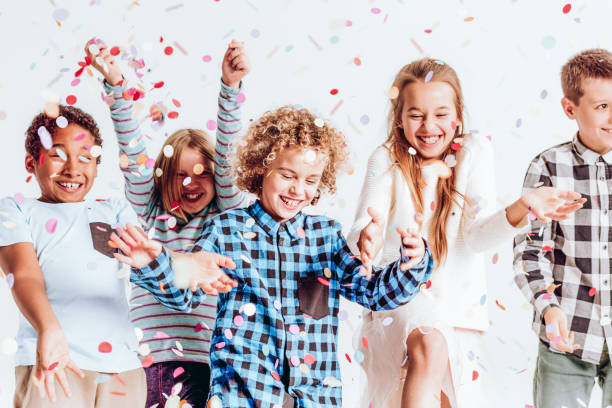 Kids with confetti stock photo