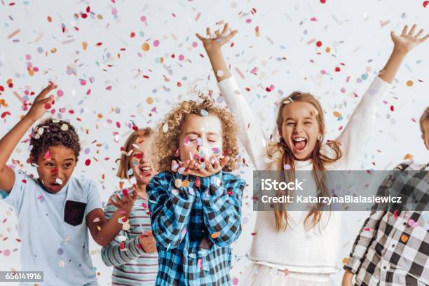 Kids In A Room Full Of Confetti Stock Photo - Download Image Now - Child, Party - Social Event, Childhood