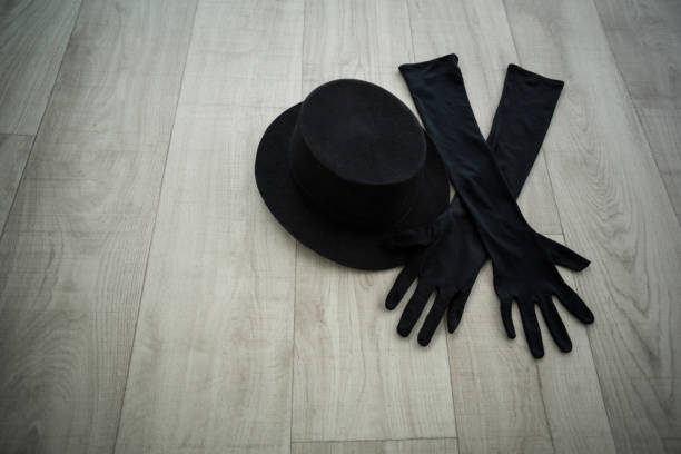 istock Bowler hat and black gloves in dance studio 656142196