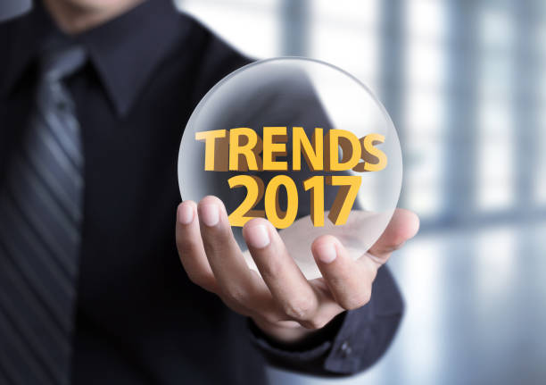 istock businessman hand holding Trends 2017 concept in crystal ball 656142496