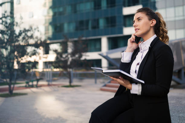 istock Businesswoman multitasking in business district 656142724