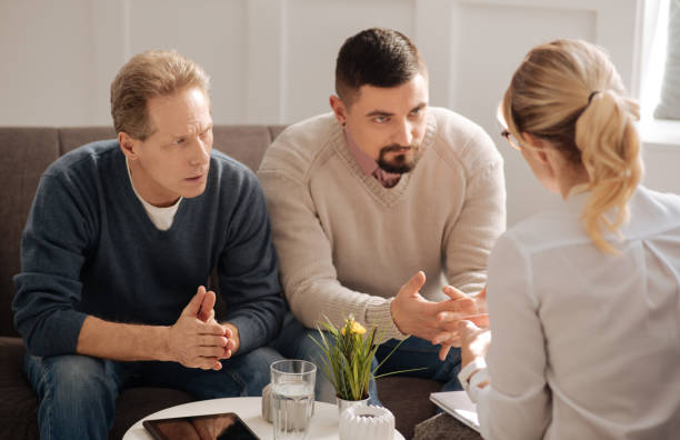 istock Sad depressed gay couple saving their relationships 656145076