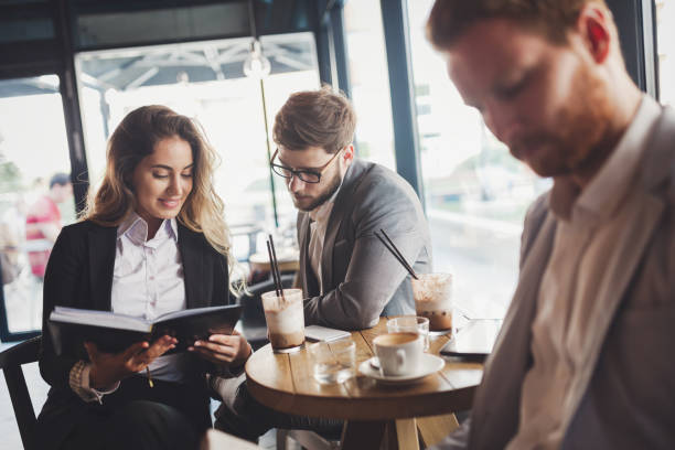 istock Business people talking and laughing together at cafe 656145706