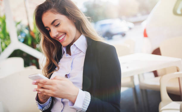 istock Beautiful woman using cellphone to text oartner 656146138