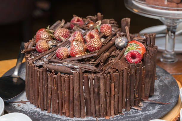 istock Tasty chocolate cake on color wooden background 656146476