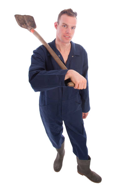 istock Young farmer with shovel isolated on white background 656149144