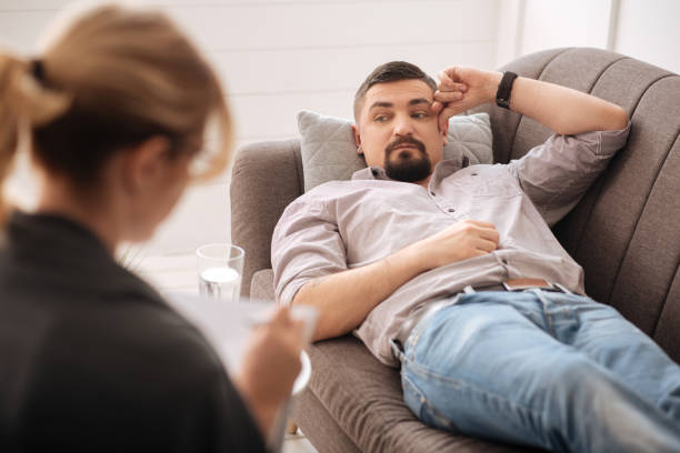 istock Sad depressed man undergoing psychological treatment 656151582