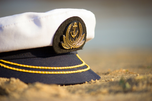 capitan cap on the beach. travel concept