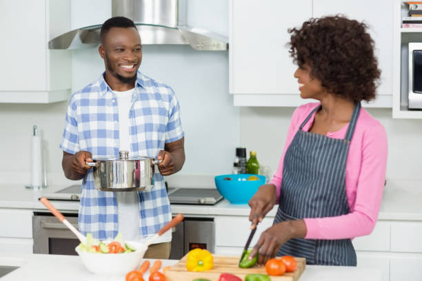 istock Smiling couple chopping vegetables in the kitchen 656158648
