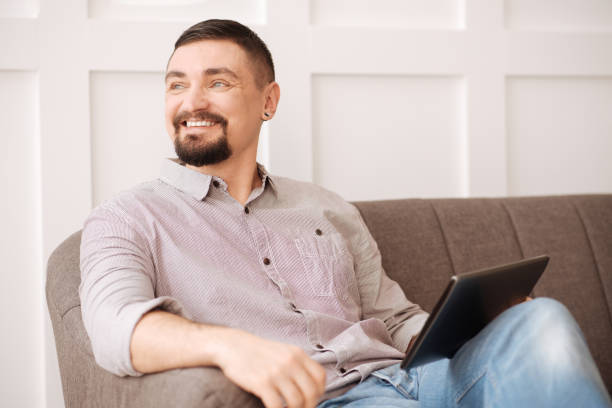 istock Positive joyful man resting at home 656159110