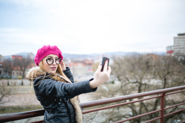 istock Fashionable girl taking a selfie 656164338