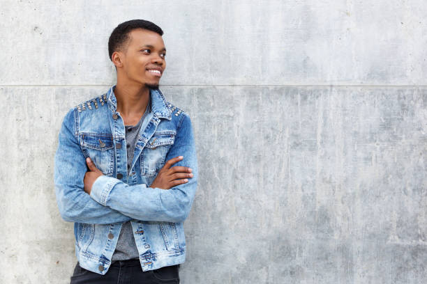 istock confident black man smiling with arms crossed 656164716