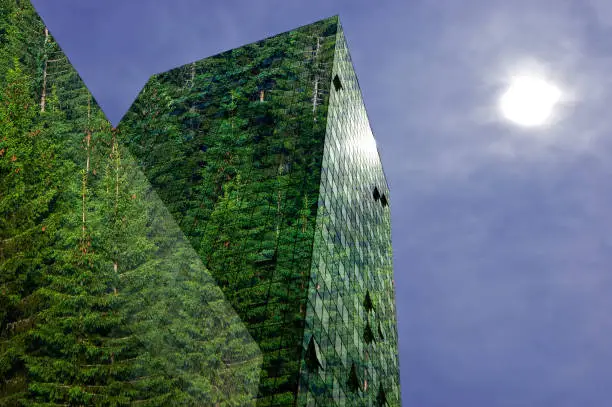 Green, renewable energy in the city: modern building covered with spruce forest. Sustainable energy, pollution and urbanity concept with copy space.