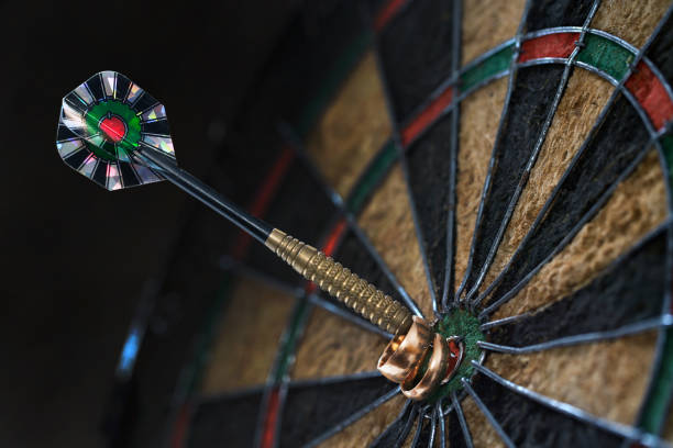istock Two wedding rings hanging on the darts arrow 656168794