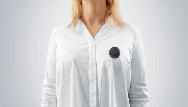 istock Blank black button badge mockup pinned on the womans chest 656169622